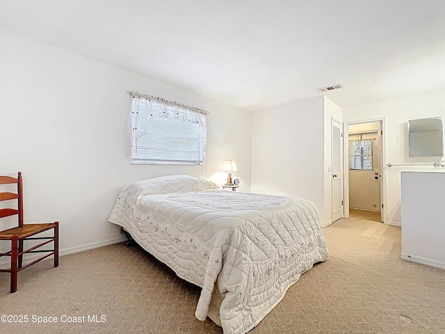 537 Ebony St, Melbourne, FL 32935 - bedroom featuring light carpet, baseboards, and a closet