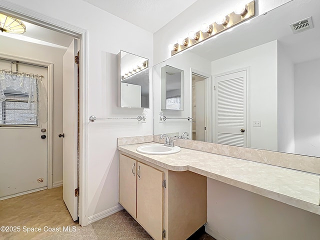 537 Ebony St, Melbourne, FL 32935 - bathroom with vanity and baseboards