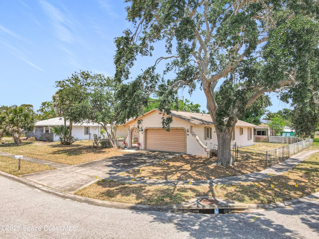 537 Ebony St, Melbourne, FL 32935 - single story home featuring concrete driveway, fence, an attached garage, and stucco siding