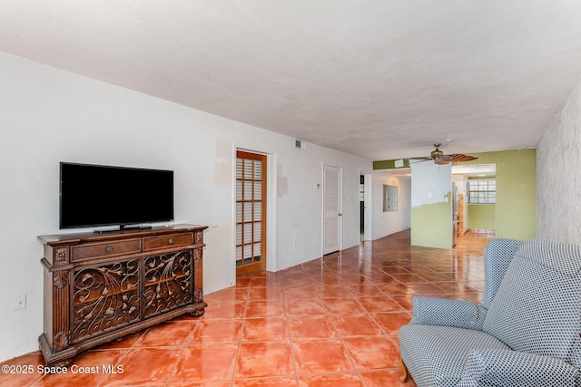 1025 Rockledge Dr Unit 502A, Rockledge, FL 32955 - living area with a ceiling fan and light tile patterned floors