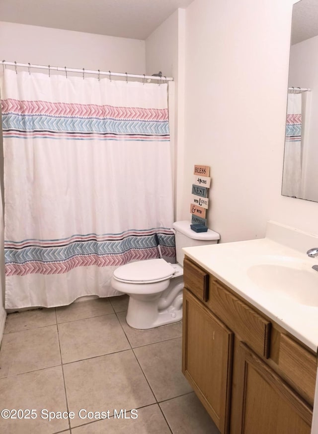 122 Morgan Cir, Sebastian, FL 32958 - full bathroom with toilet, a shower with curtain, tile patterned flooring, and vanity