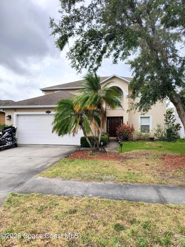 122 Morgan Cir, Sebastian, FL 32958 - view of front of home featuring an attached garage, concrete driveway, stucco siding, and a front yard