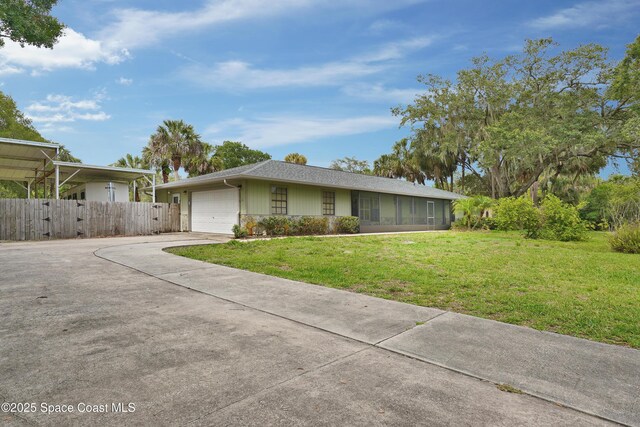 670 Kings Way, Merritt Island, FL 32953 - single story home with concrete driveway and a garage