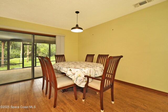 670 Kings Way, Merritt Island, FL 32953 - dining room with light wood-type flooring and baseboards