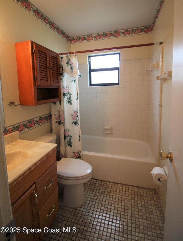 full bath featuring tile patterned floors, shower / tub combo, vanity, and toilet
