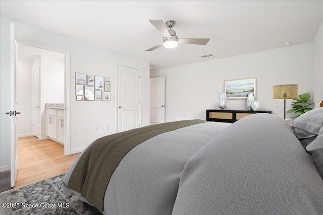 bedroom featuring visible vents, ceiling fan, light wood finished floors, and baseboards