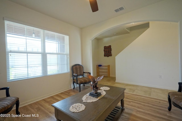 436 Great Falls Ln SW, Palm Bay, FL 32908 - sitting room featuring ceiling fan, visible vents, arched walkways, baseboards, and light wood-style flooring