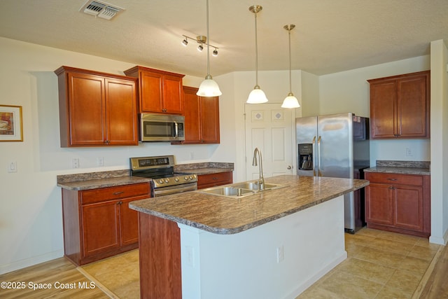 436 Great Falls Ln SW, Palm Bay, FL 32908 - kitchen featuring visible vents, a center island with sink, a sink, hanging light fixtures, and stainless steel appliances