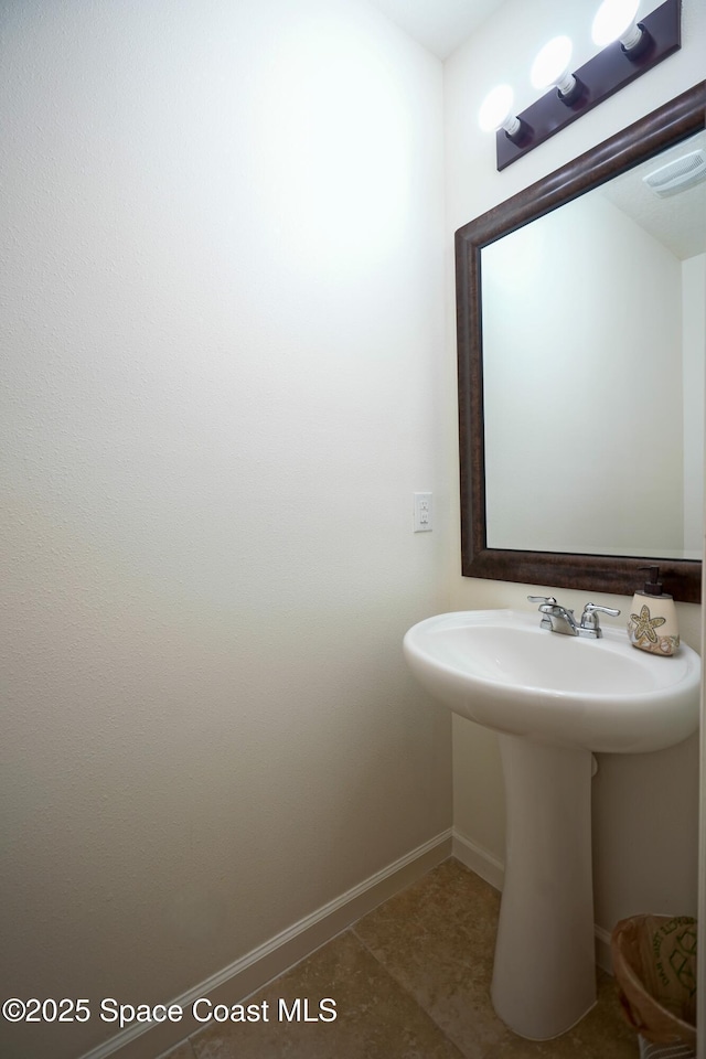 436 Great Falls Ln SW, Palm Bay, FL 32908 - bathroom featuring baseboards, a sink, and tile patterned floors