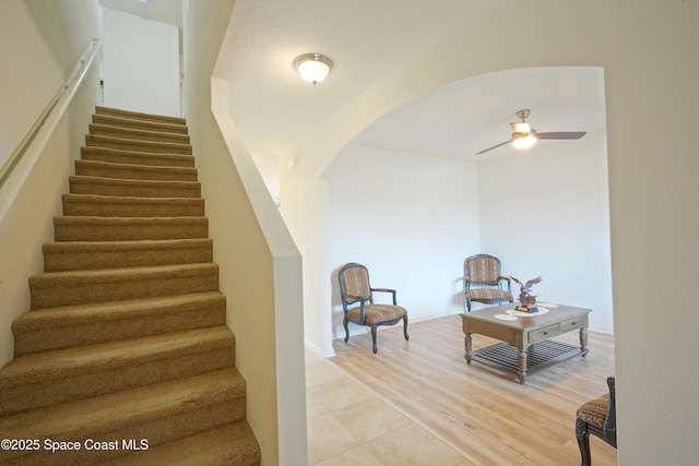 436 Great Falls Ln SW, Palm Bay, FL 32908 - stairway featuring a ceiling fan and arched walkways