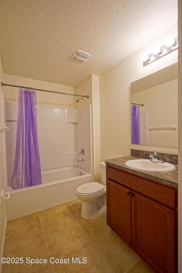 436 Great Falls Ln SW, Palm Bay, FL 32908 - bathroom with a textured ceiling, tile patterned flooring, vanity, toilet, and shower / bathtub combination with curtain