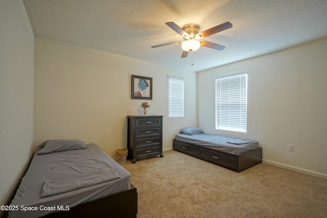436 Great Falls Ln SW, Palm Bay, FL 32908 - bedroom featuring a textured ceiling, ceiling fan, light colored carpet, and baseboards