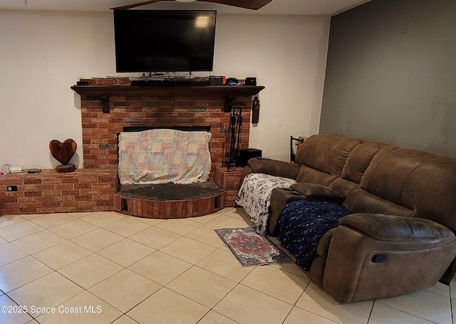 4805 Worth Ave, Titusville, FL 32780 - living room featuring light tile patterned floors, a ceiling fan, and a brick fireplace