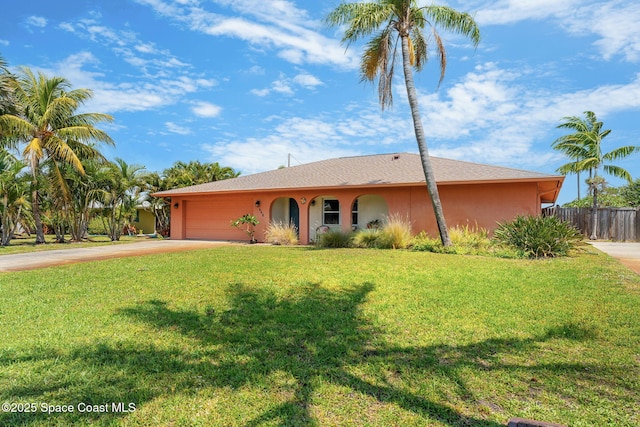 ranch-style home with stucco siding, concrete driveway, and an attached garage