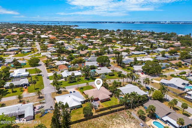aerial perspective of suburban area featuring a large body of water