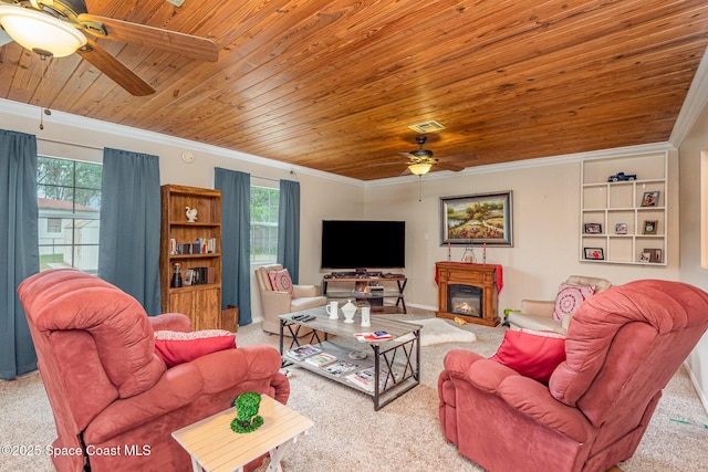 carpeted living area with crown molding, ceiling fan, visible vents, and wood ceiling