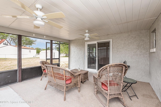 sunroom / solarium with ceiling fan