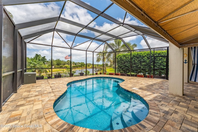 pool with a patio and a lanai
