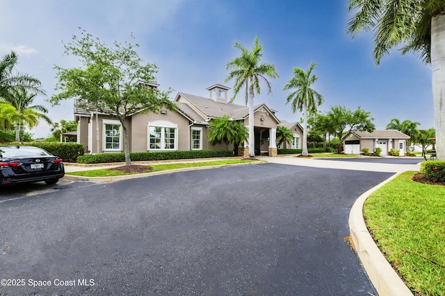 single story home featuring stucco siding