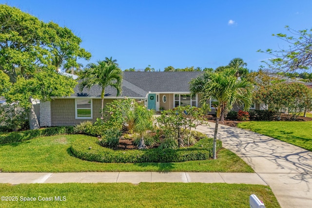 320 Amberjack Pl, Melbourne Beach, FL 32951 - ranch-style home featuring driveway and a front lawn