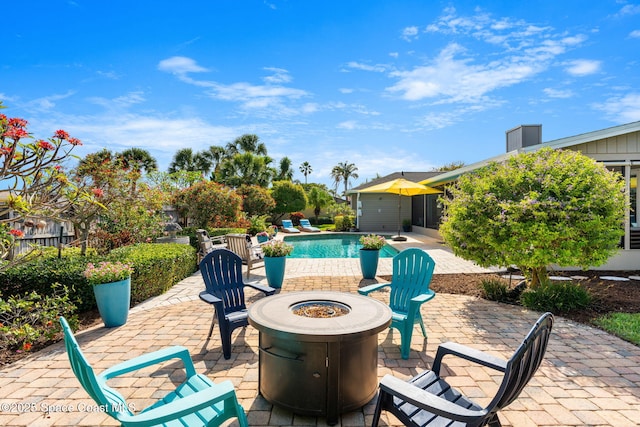 320 Amberjack Pl, Melbourne Beach, FL 32951 - view of patio / terrace with an outdoor fire pit and an outdoor pool