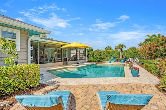 320 Amberjack Pl, Melbourne Beach, FL 32951 - pool featuring a ceiling fan, a patio area, and a sunroom