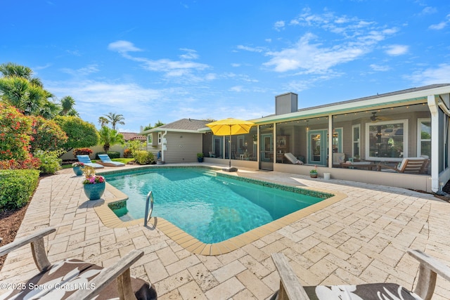 320 Amberjack Pl, Melbourne Beach, FL 32951 - view of pool featuring a fenced in pool, a sunroom, and a patio area