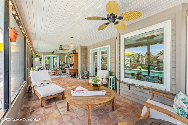320 Amberjack Pl, Melbourne Beach, FL 32951 - sunroom featuring a ceiling fan, plenty of natural light, and french doors