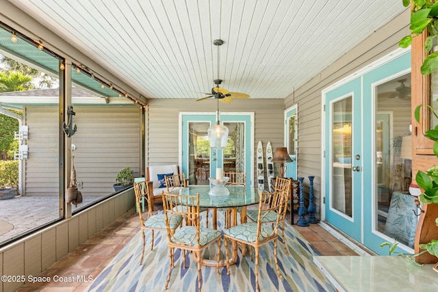 320 Amberjack Pl, Melbourne Beach, FL 32951 - sunroom with french doors, a ceiling fan, and outdoor dining area