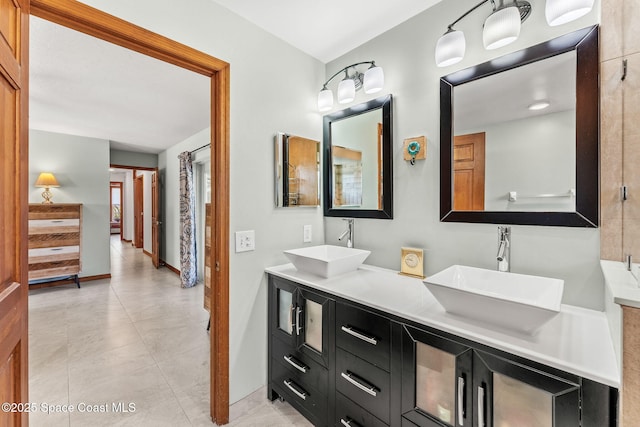 320 Amberjack Pl, Melbourne Beach, FL 32951 - bathroom featuring double vanity, tile patterned floors, and a sink