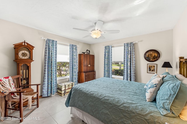 320 Amberjack Pl, Melbourne Beach, FL 32951 - bedroom with light tile patterned flooring and a ceiling fan
