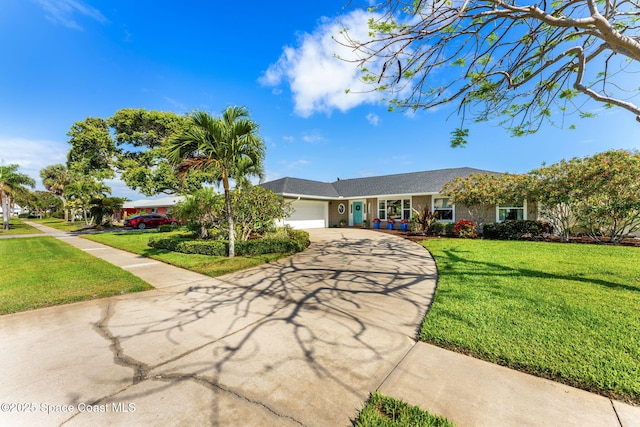 320 Amberjack Pl, Melbourne Beach, FL 32951 - ranch-style home featuring an attached garage, concrete driveway, and a front lawn