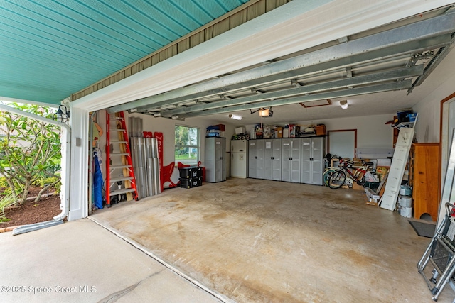 320 Amberjack Pl, Melbourne Beach, FL 32951 - garage featuring a garage door opener