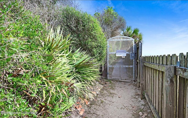 view of gate featuring fence