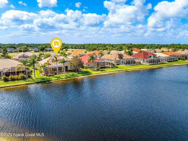 drone / aerial view featuring a water view and a residential view