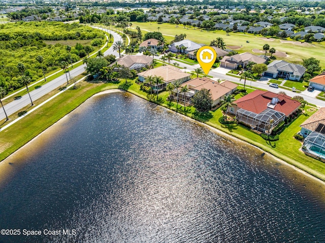birds eye view of property with a water view, a residential view, and golf course view