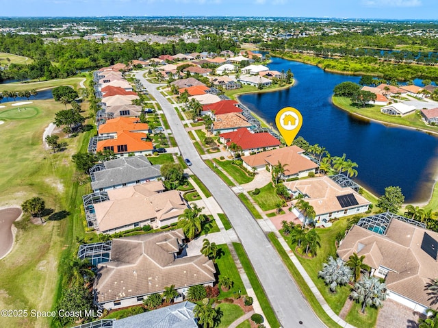 drone / aerial view with a water view, a residential view, and golf course view