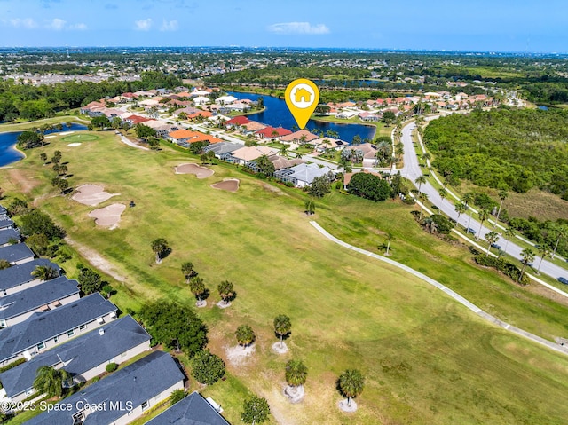 aerial view with a water view, view of golf course, and a residential view