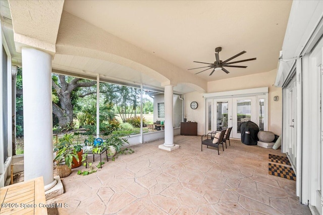 sunroom / solarium featuring french doors