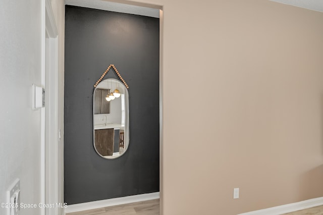 details featuring baseboards and wood finished floors