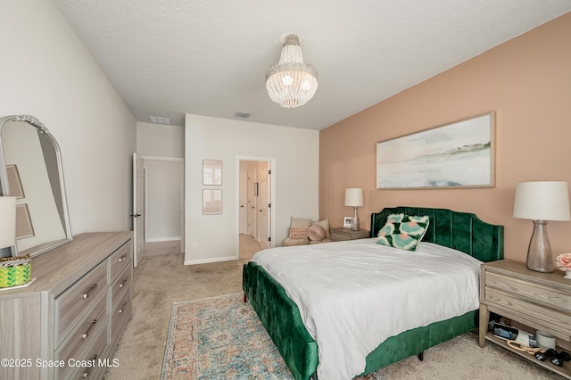 bedroom with a notable chandelier, visible vents, light carpet, and baseboards