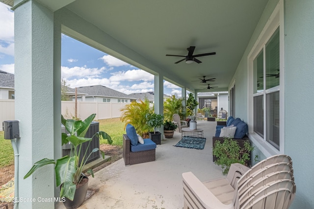 view of patio / terrace with central AC, ceiling fan, and fence