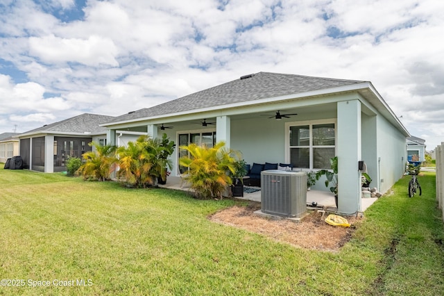 back of house featuring a ceiling fan, central AC unit, a yard, a patio, and a shingled roof