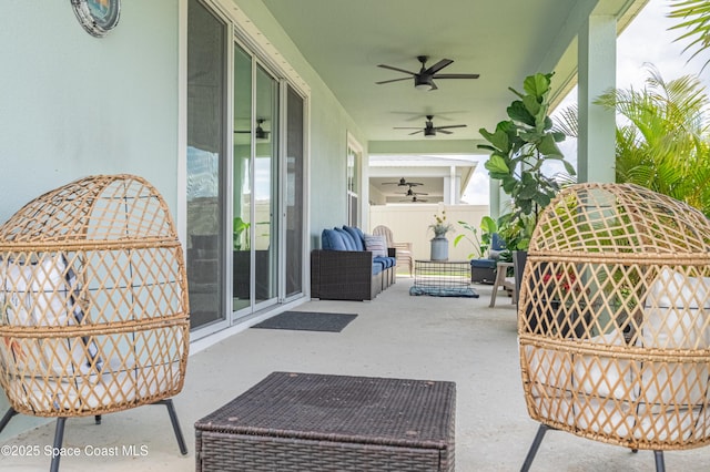 view of patio / terrace with ceiling fan and outdoor lounge area