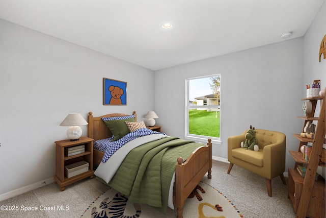 carpeted bedroom with baseboards