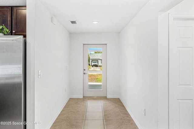 1591 Palatka Rd SE, Palm Bay, FL 32909 - entryway featuring light tile patterned flooring, baseboards, visible vents, and recessed lighting