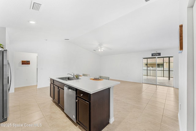 1591 Palatka Rd SE, Palm Bay, FL 32909 - kitchen with a ceiling fan, light tile patterned flooring, open floor plan, a sink, and stainless steel appliances