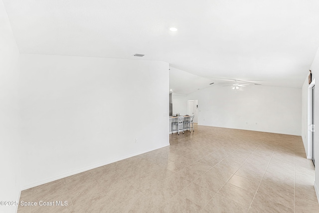 1591 Palatka Rd SE, Palm Bay, FL 32909 - unfurnished living room with a ceiling fan, visible vents, baseboards, lofted ceiling, and recessed lighting