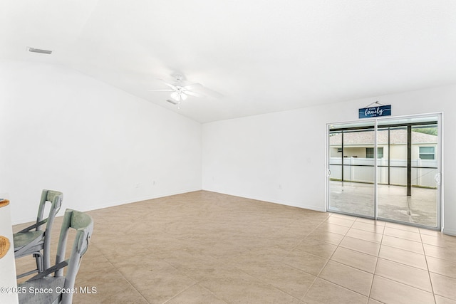 1591 Palatka Rd SE, Palm Bay, FL 32909 - empty room featuring light tile patterned flooring, ceiling fan, baseboards, lofted ceiling, and visible vents