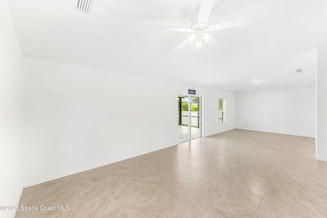 1591 Palatka Rd SE, Palm Bay, FL 32909 - spare room with visible vents, a ceiling fan, baseboards, and light tile patterned floors